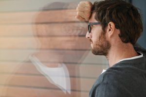 Man staring out of the window