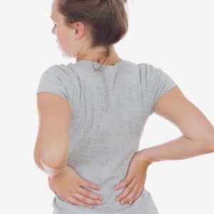 Young woman with lower back pain