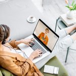 Business woman having a video call with coworker, working online from home at cozy atmosphere. Concept of remote work from home