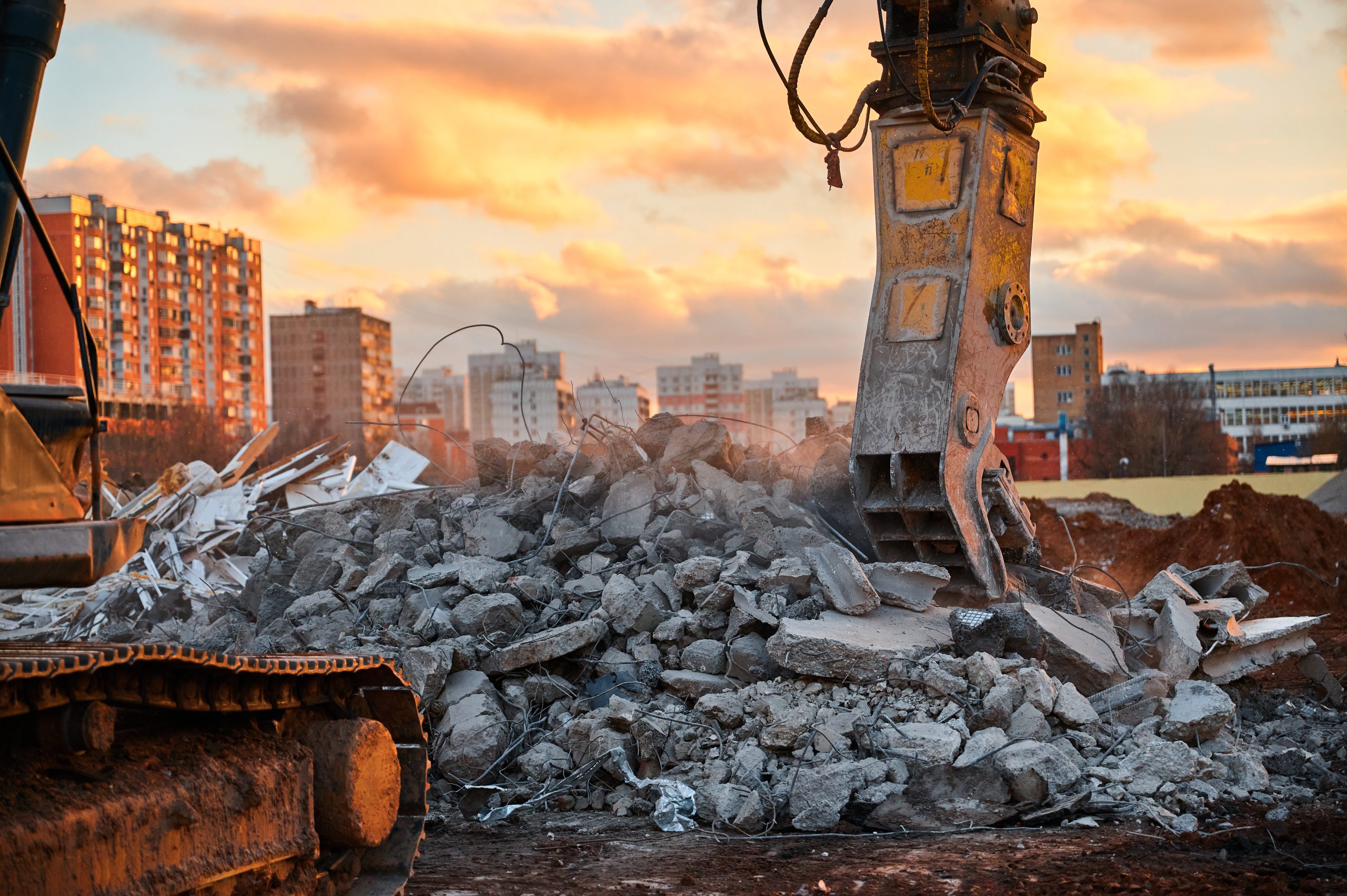 Crusher destroys reinforced concrete at demolition site