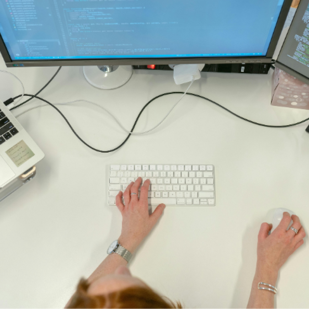 A person using 3 different displays simultaneously.