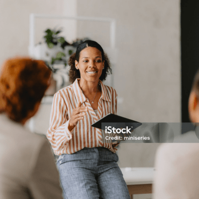 rigorous-training-and-quality-standards An instructor offering advice to an audience
